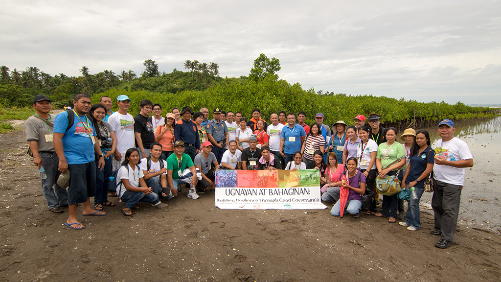 Participants of "Ugnayan at Bahaginan" pose for a photo after their field visit to the mangrove plantation in Brgy. Cagsao, Calabanga, Camarines Sur. (Jigs Tenorio / ACCORD)